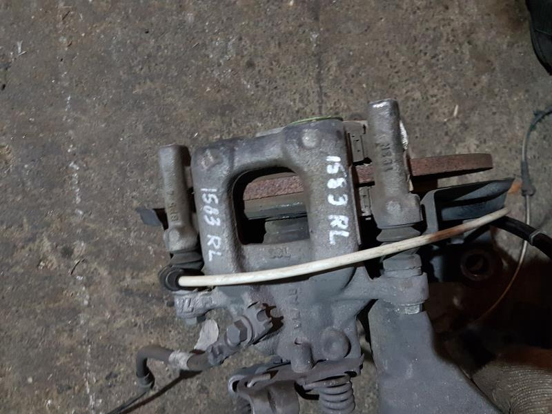 Суппорт зад лев Volkswagen Passat B7 2.5 1.8 USA 2011-2015 5K0615423